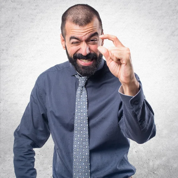 Man doing tiny sign — Stock Photo, Image