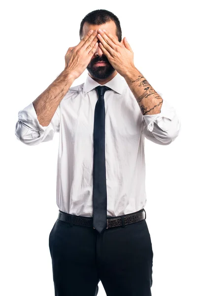 Businessman covering his eyes — Stock Photo, Image