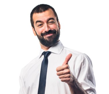 Baş parmağı havada bir iş adamı.