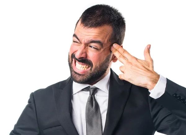 Businessman making suicide gesture — Stock Photo, Image