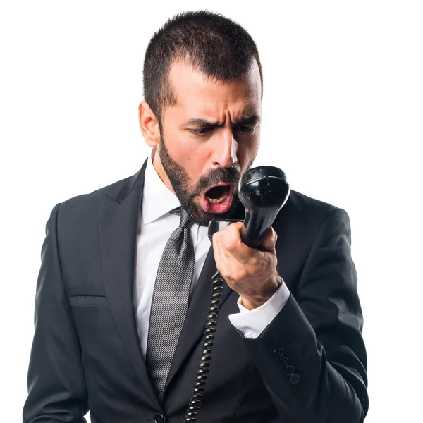 Businessman making phone gesture — Stock Photo, Image