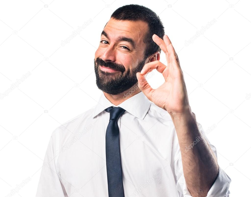 Businessman making OK sign