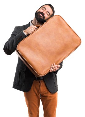 Elinde evrak çantası olan bir adam.