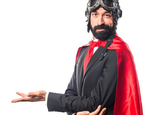 Super hero businessman presenting something