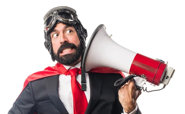 Super héroe hombre de negocios gritando por megáfono —  Fotos de Stock