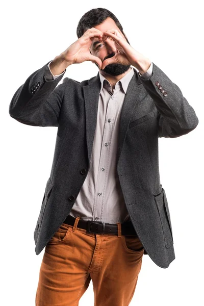 El hombre haciendo un corazón con sus manos — Foto de Stock