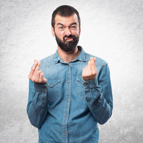 Man doing a money gesture — Stock Photo, Image