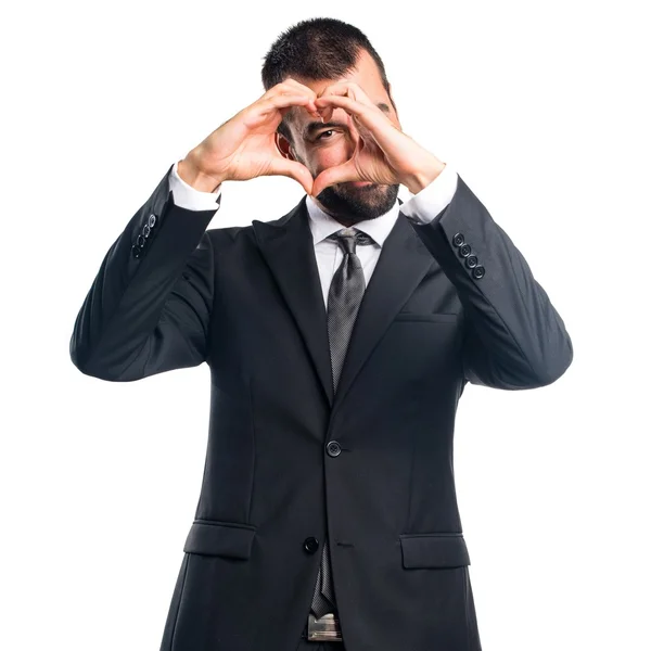 Businessman making a heart with his hands — Stock Photo, Image