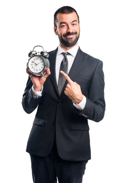 Affärsman holding vintage klocka — Stockfoto