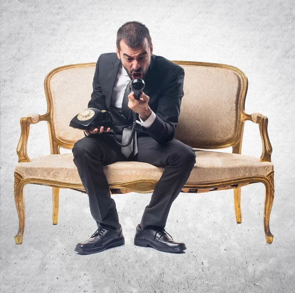 Empresario hablando con teléfono vintage — Foto de Stock