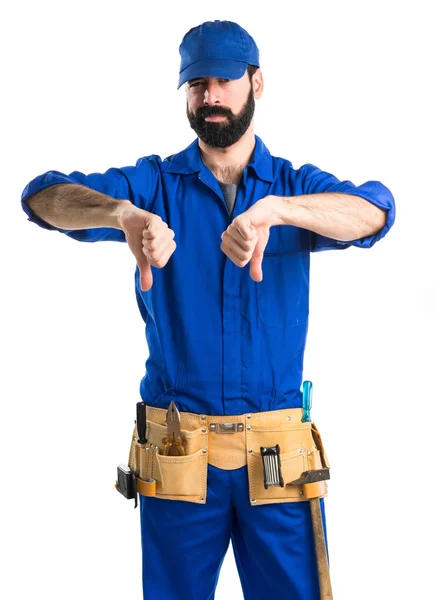 Plumber doing bad signal — Stock Photo, Image