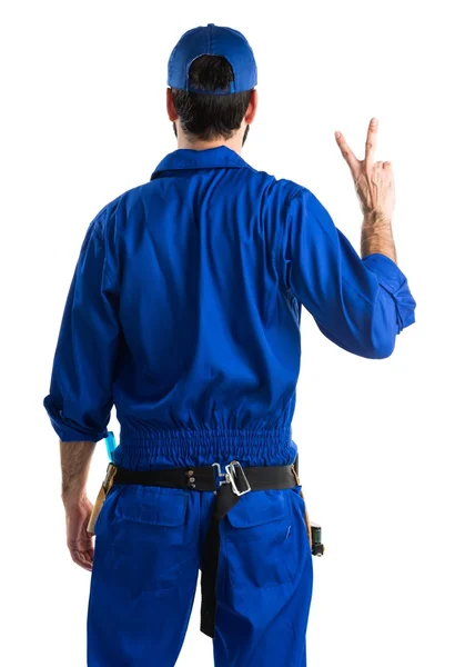 Plumber doing victory gesture — Stock Photo, Image
