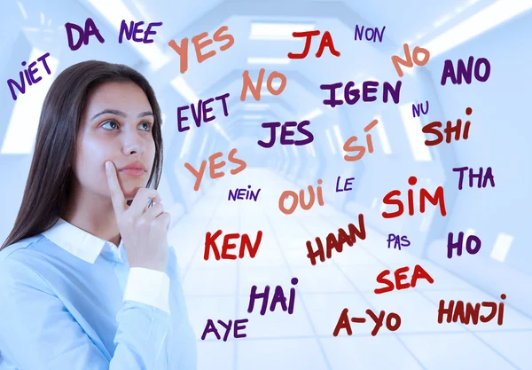 Young brunette girl and word yes in many languages — Stock Photo, Image