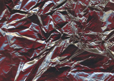  Crinkled metallic surface background. Crumpled red metal texture. Metal foil gloss abstract.