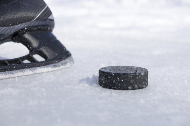 hockey skate and puck