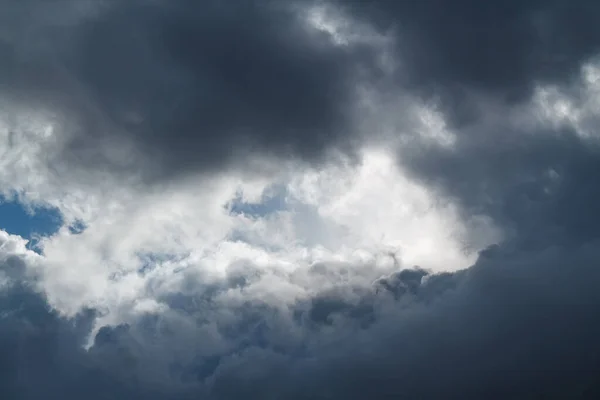 White clouds on a blue background. A fluffy and soft cloud. Blue cloud background.