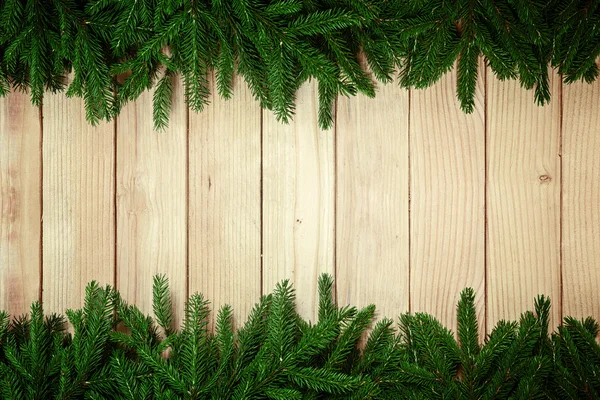 Christmas background -Fir tree on wooden table — Stock Photo, Image