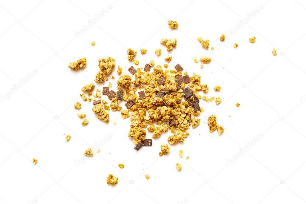 Pile of crunchy muesli with chocolate on white background