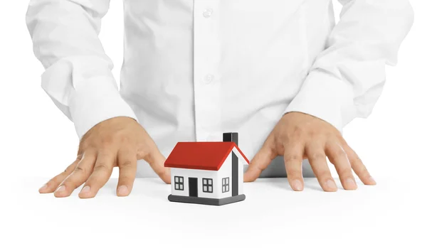 Real estate agent with house model — Stock Photo, Image