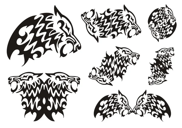 Symboles de loups tribaux. Noir sur le blanc — Image vectorielle