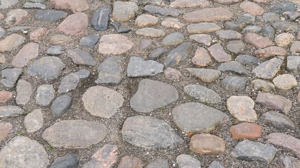 Bakgrundsstruktur av stenmur. trottoaren — Stockfoto