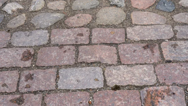 Bakgrundsstruktur av stenmur. trottoaren — Stockfoto