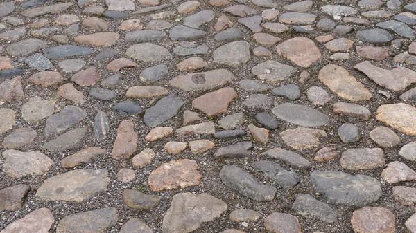 Bakgrundsstruktur av stenmur. trottoaren — Stockfoto