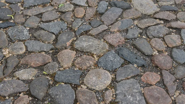 Bakgrundsstruktur av stenmur. trottoaren — Stockfoto