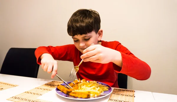 Äta autistisk pojke hälsa nutrition Royaltyfria Stockbilder