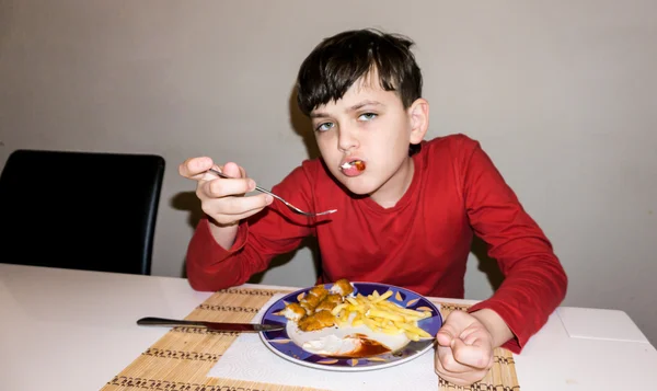 Äta autistisk pojke hälsa nutrition Stockfoto