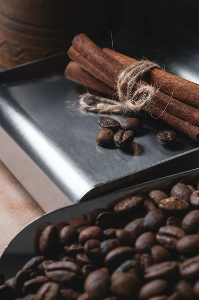 Cinnamon and a bunch of coffee beans — Stock Photo, Image