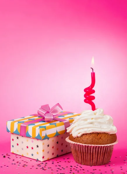 Cupcake with candle and  gift — Stock Photo, Image
