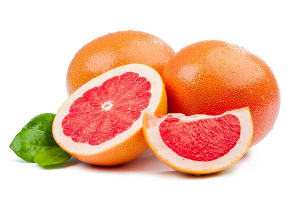 Two grapefruit and slices with leaves isolated — Stock Photo, Image