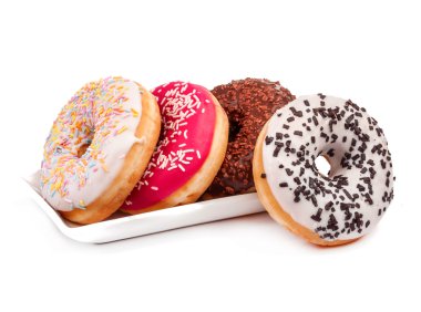 Dört çörek ve izole fincan tabağı