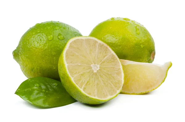 Limes and slice with leaves isolated — Stock Photo, Image