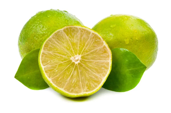 Limes and slice with leaves isolated — Stock Photo, Image