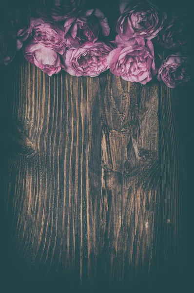 Tea rose on wooden background — Stock Photo, Image