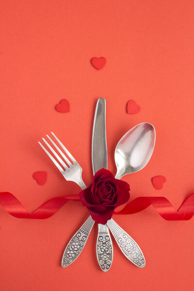 Top view of festive table setting for Valentine 's day on the red background