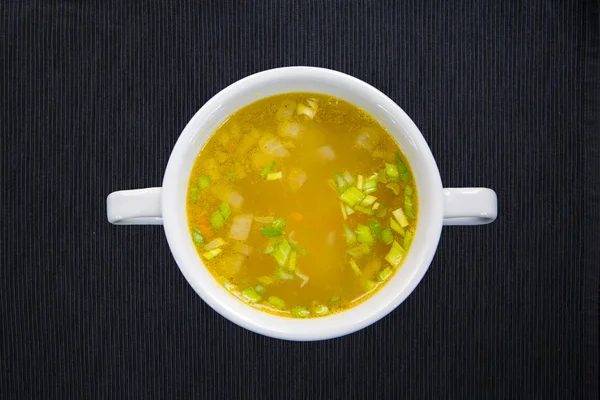 White cup with soup — Stock Photo, Image