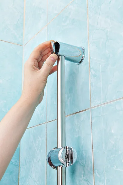 Closeup of repairman hand closes the cover bracket shower holder — Stockfoto