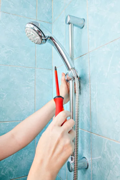 Closeup, repair and adjustment of height adjustable holder bathroom shower. — Stock Photo, Image