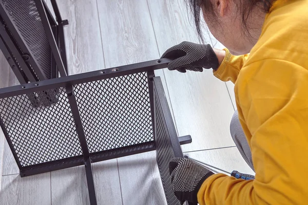 Assembly of metal cabinet with storage shelves or television stand. — Stock Photo, Image