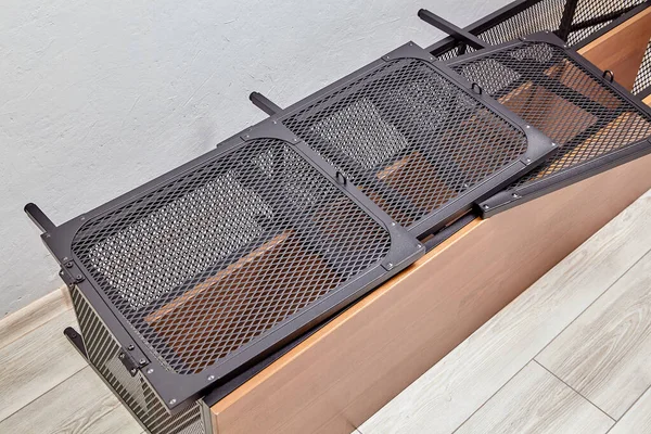 Disassembled modern wood shelf with black metal doors. — Stock Photo, Image