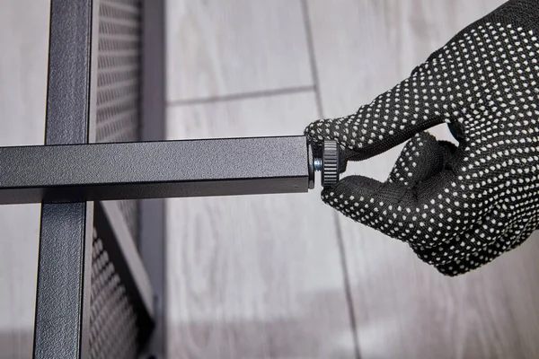 Assembler Gloves Tightening Bolt While Mounting Flat Pack Furniture Handyman — Stock Photo, Image