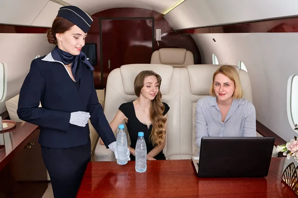 Smiling Air Hostess Serving Passengers Plane First Class While Sitting — Stock Photo, Image