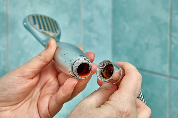 Defective shower head needs to be replaced with new one. — Stock Photo, Image