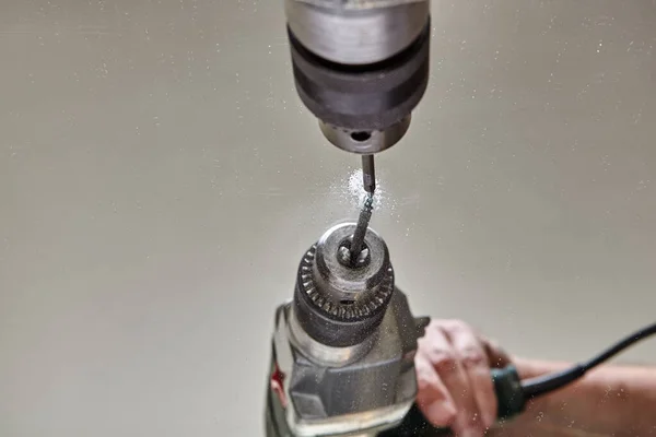 Drilling hole in glass or mirror with special drill bit. — Stock Photo, Image