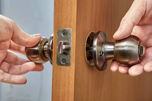 Combination of two parts of handle inside door. Repair or replacement of an old doorknob. — Stock Photo, Image