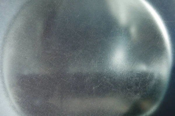 Kaldırım aydınlatma merceğinin pejmürde cam dokusu.