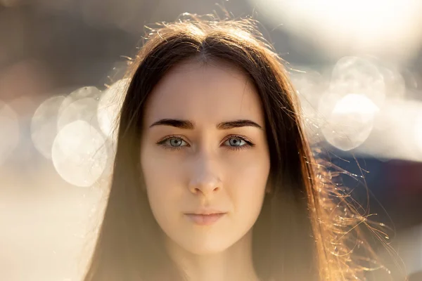 Serious woman with pensive look is posing outside for portrait. — Stock Photo, Image